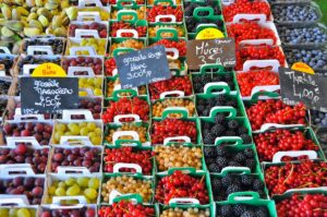 stack of fruits with signage